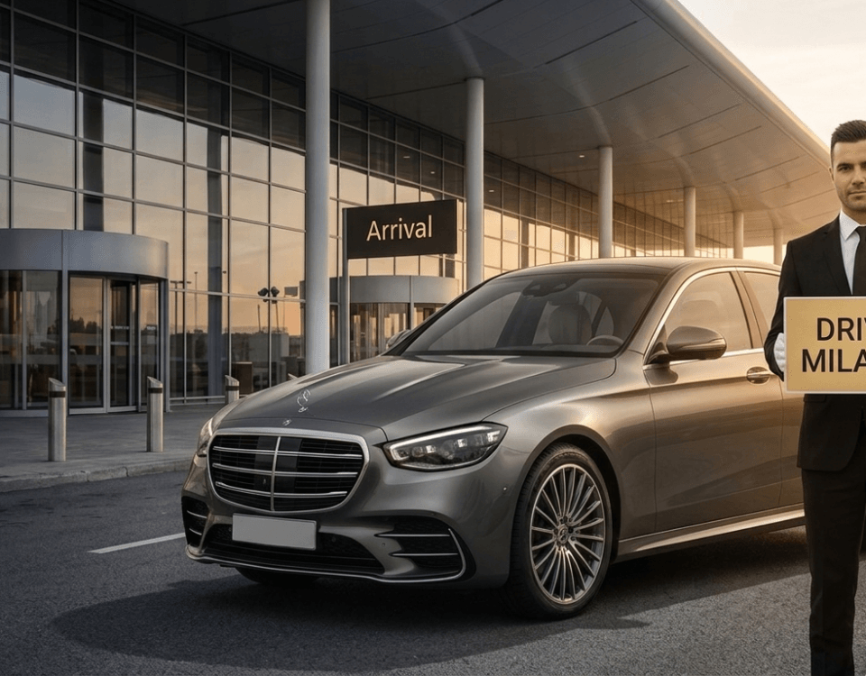 Professional chauffeur in black suit holding Drive Milano sign at airport arrival hall with luxury Mercedes S-Class